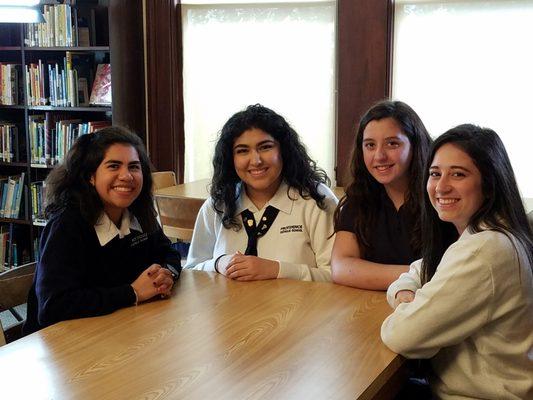 Student leaders meeting in the library.