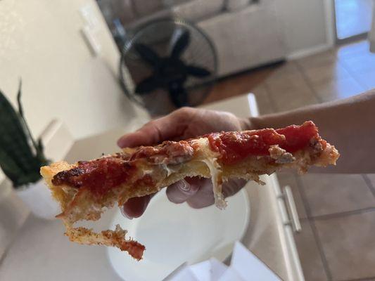 This slice had the most amount of sausage on it and it's still sparse.