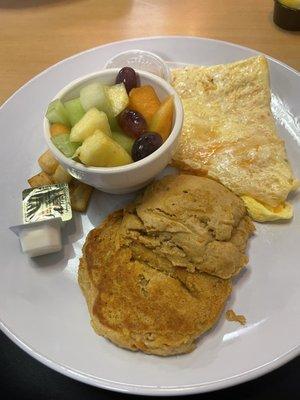 Three cheese omelette with fresh fruit and pumpkin biscuit.