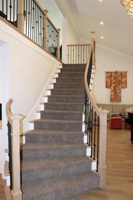 We constructed a new cantilevered stairway leading from the expanded entryway to the second story of this Villa Park home.