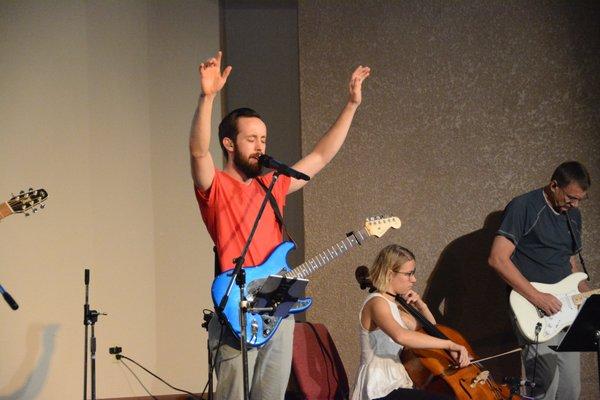 Worship Pastor, Danny Rausch, leading worship during a Sunday morning service.