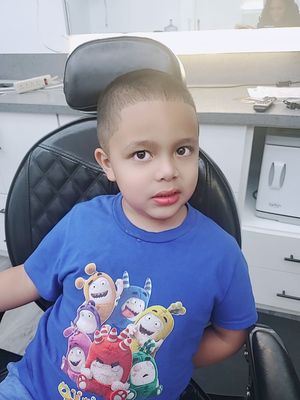 Son happy wirh haircut