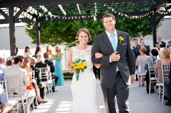 Just married! Walking down the aisle as Mr. and Mrs. in our outdoor ceremony area! Photography: Arlynne VanHook Photography