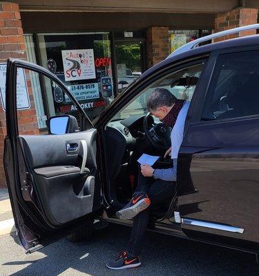 My husband took a picture of Lou trying to reprogram my keys.