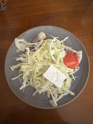 Salad with cabbage, onions, tomatoes and feta