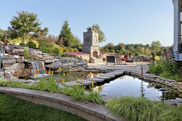 Fireplace, patio and waterfall with Koi pond.