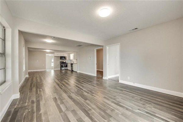 After picture living room kitchen view