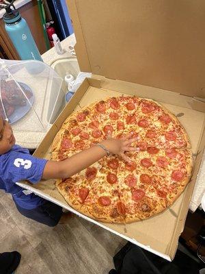 Giant pizza. I believe this is the large size. There's one more size larger after this.