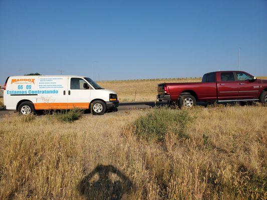 My car being towed from the exit of his dealership.