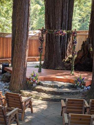 The "altar/stage" area of the venue.  Arch and flowers by Pink Petals.