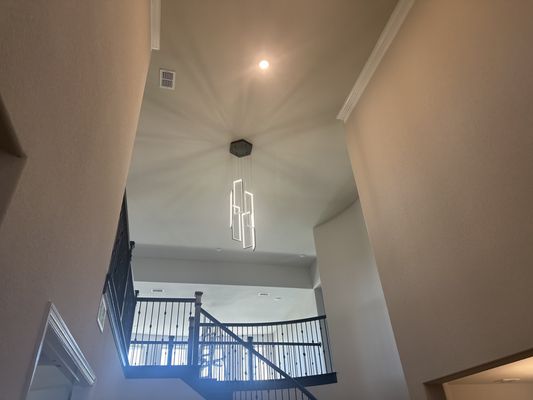 Chandelier to replace standard can light over stairs