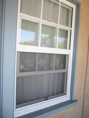 vinyl window up down with clear glass and grids, block frame dual glaze installed.