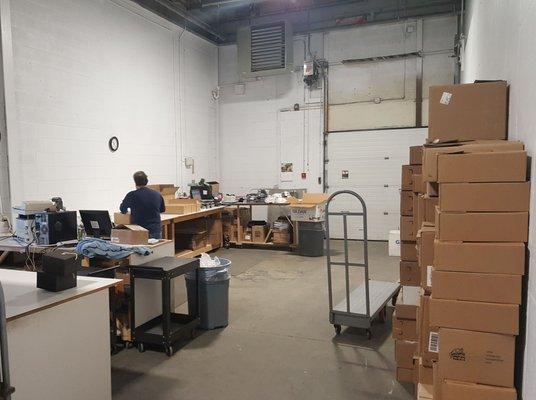 Our shipping department getting custom apparel orders out the door!