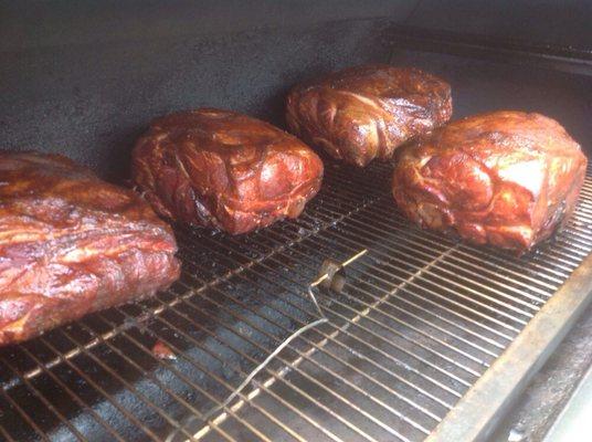 A few pork butts being smoked low & slow with hickory