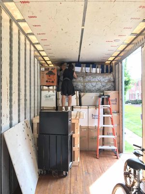 Movers from Boost Express Van Lines during delivery process in Edmond, OK.