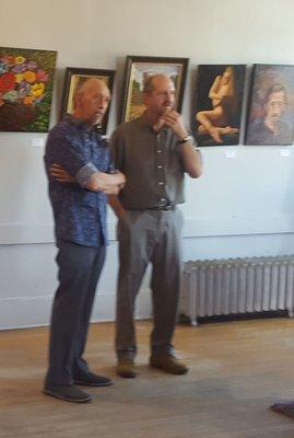 One of the local artists (on right) with me discussing the work.