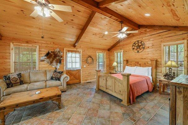 The Texas Room,  has a queen size bed , sitting area, private porch, kitchenette and  bathroom. Sleeps 2