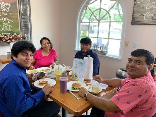 Customers enjoying our sandwiches.