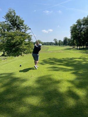 Hole 2, par 4 with severe slope from right to left of in the fairway