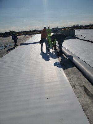 This job required a total recover of the existing roof with a new 60-mil white TPO (thermo plastic polyolefin) roof and all new metal.