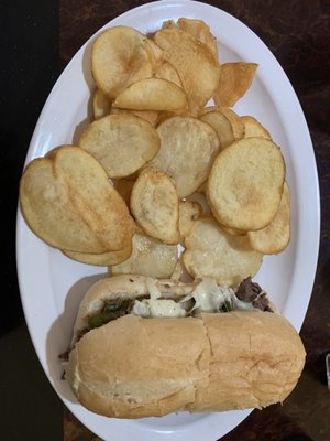 Lunch special. Cheese steak with onions and green peppers comes with mushrooms. Homemade potato chips. Get a drink included.