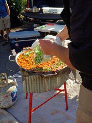 Devin constructing the paella