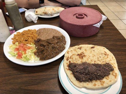 Carne guisada plate and a barbacoa taco.