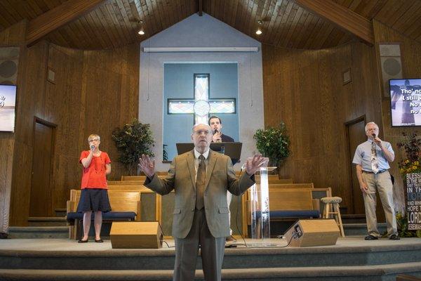 Pastor Doug Bradley with Junior Pastor Jake Carver and the worship team.