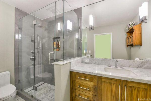 A frame-less shower enclosure,  with a pony wall is just right for upgrading!