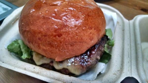 Short rib burger with bacon jam, lettuce, tomato, and havarti