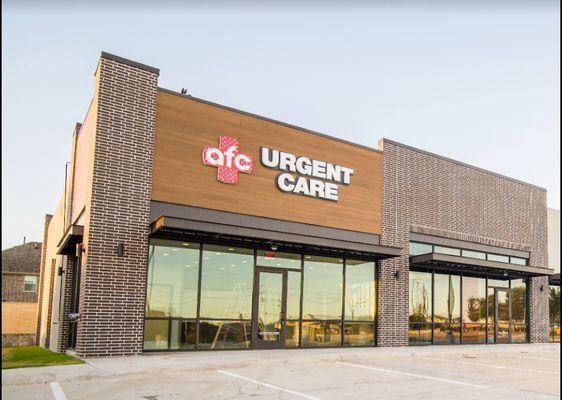 Exterior photo of AFC Urgent Care Allen and it's parking lot.