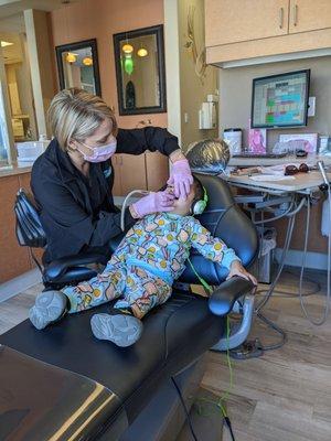 Kid friendly staff and chair.. headphones for the TV in the ceiling while they're laying down.