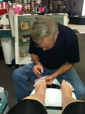 The husband doing my pedi. He did a great job!