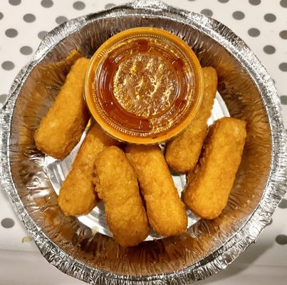 Mozzarella sticks. Yummy, cheesy, and crisp! Great sauce.