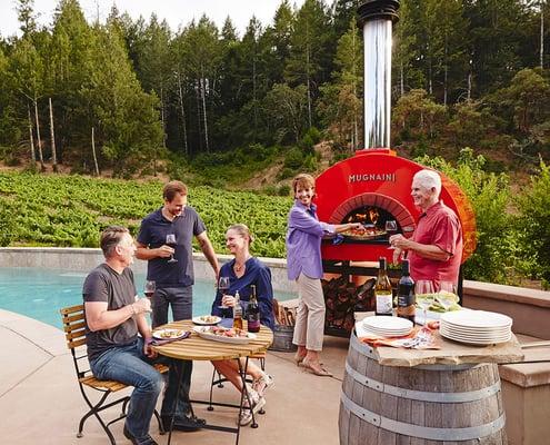 Outdoor entertaining with a Mugnaini wood-fired oven.