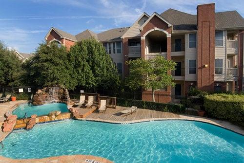 View of the pool, the waterfall, and some of the apartments.