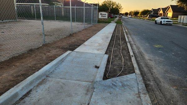 Dripline being lay down to water efficiently new grass.