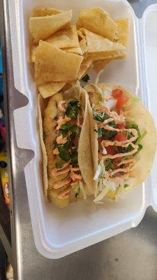 Beer batter fish tacos with chipotle dressing  cabbage and pico.