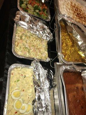 Shrimp pasta salad, Potato salad, Cruzan Stuffing, Yams, Curry Chick peas & vegetables