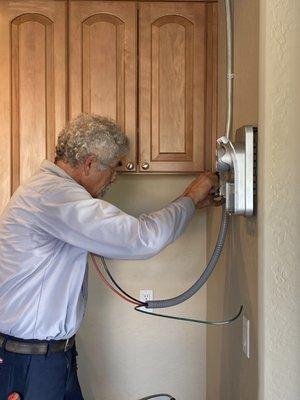 SVSS Electrician installing a car charger.