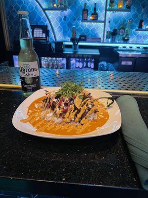 Shrimp Chile relleno on a bed of rice with a creamy chipotle sauce!