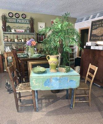 Small rehabbed cafe table with old ladder back chairs