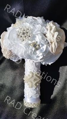 Elaborately detailed satin singed flower bridal bouquet by Rad Couture Boutique. Bridal accessories are custom ordered.