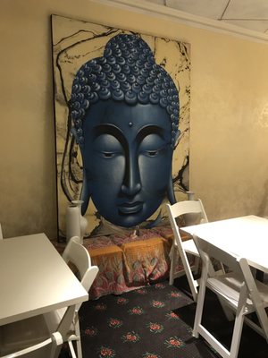 Blue medicine Buddha painting in the dining room