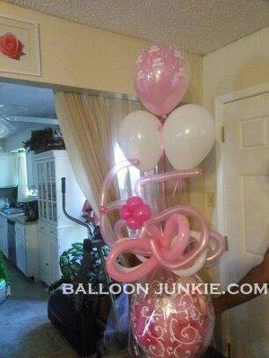 Gift in A Balloon with numbers and a bouquet of balloons above.