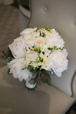 Bridal bouquet full of beautiful Peonies, roses, ranunculus, etc