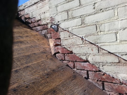 Removed old copper flashing.  Getting ready to patch bricks and then install a flashing system with the roofing.