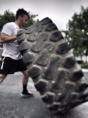 Zach flipping tires and running sprints