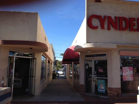 Entrance off Third Avenue, between Cynderella bridal shop and Burdick's Sewing & Vacuum. Head into this walkway.