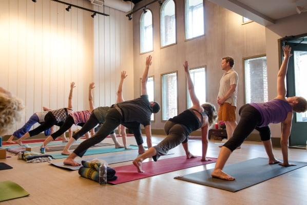 Open your Body, Feed your Soul with deep twists and lunging in a yoga class at Delta Groove!